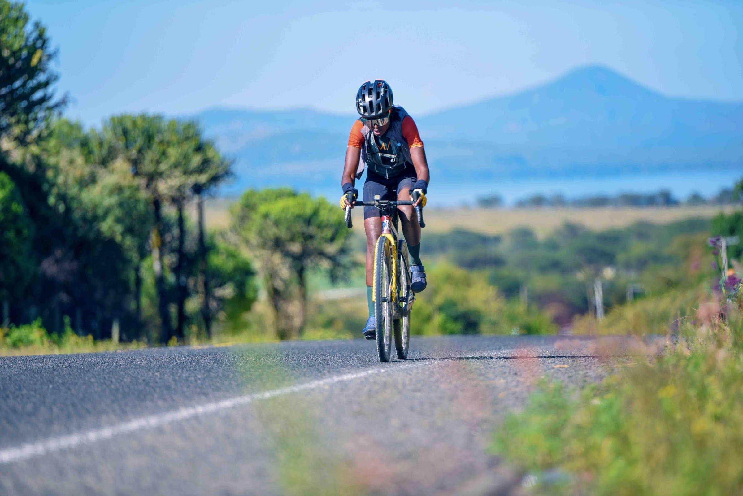 Cyclist on a lakeside road